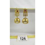 A pair of (test as 24ct gold) pendant earrings set rubies. 10.4 grams.