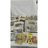 A mixed lot of old postcards, loose and in album, topographical, humorous etc.