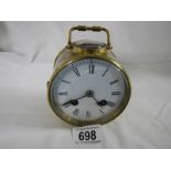 A 19th century brass drum cased carriage clock striking on a bell.