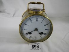 A 19th century brass drum cased carriage clock striking on a bell.