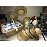 A quantity of linen and vintage hats in an old wicker basket.