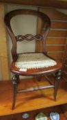 A Victorian Child's balloon back chair.