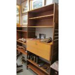 A 1970's teak interchangeable wall unit with bureau.