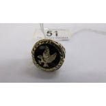 A gentleman's 9ct gold ring with a gold eagle inserted into an onyx base, gold open work shoulders,