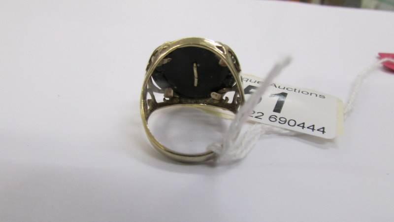 A gentleman's 9ct gold ring with a gold eagle inserted into an onyx base, gold open work shoulders, - Image 3 of 3