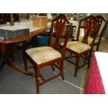 A mahogany extending dining table and 6 chairs.