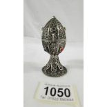 A Judiaca Russion lion topped stone set white metal filigree egg, Russian silver marks.