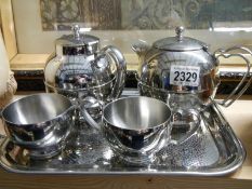 An unusual style 5 piece 'Olde Ball' stainless steel tea set.