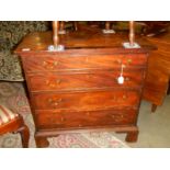 A 4 drawer mahogany chest.