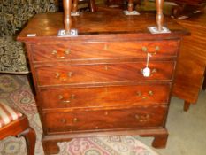 A 4 drawer mahogany chest.