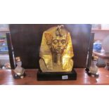 A gilded bust of Tut-ank-amun and 2 smaller busts.