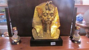 A gilded bust of Tut-ank-amun and 2 smaller busts.