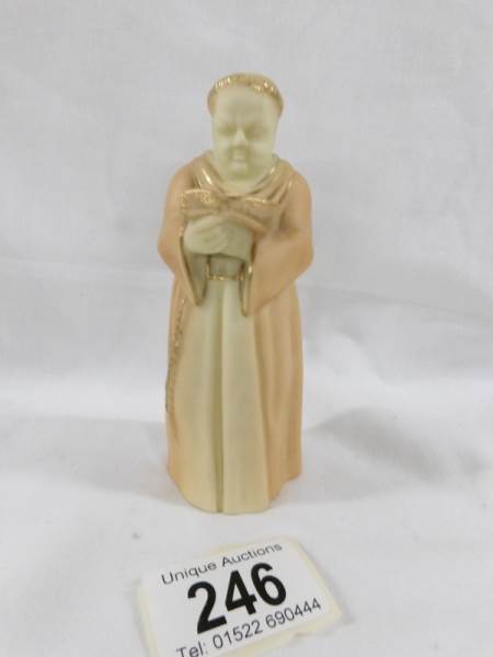 An early Royal Worcester candle snuffer in the form of a monk.