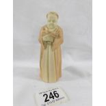 An early Royal Worcester candle snuffer in the form of a monk.