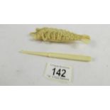 A rare and unusual carved ivory lobster (a/f) and an ivory crochet hook.