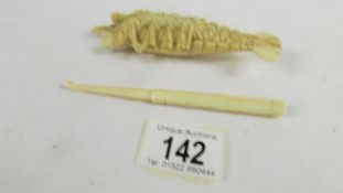 A rare and unusual carved ivory lobster (a/f) and an ivory crochet hook.