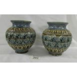 A pair of lovery 15.5 cm Doulton Lambeth bowls with various markings on base of each.