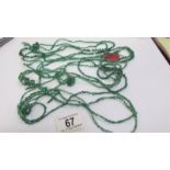 Four long rows of emerald beads, approximate length per strand 4.5 feet.
