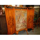 A large Victorian tapestry screen in and oak and walnut frame on pad feet.