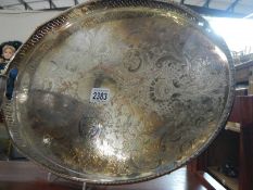 A large oval silver plate gallery tray.