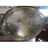 A large oval silver plate gallery tray.