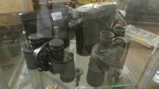 2 cased pairs of binoculars.