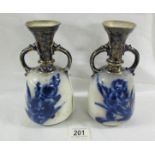 A pair of Doulton Burslem 'Faience' 22 cm tall vases with shoulder cream and blue gilding,