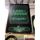 A large retro painted metal sign adverising Landrover.