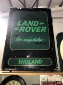 A large retro painted metal sign adverising Landrover.