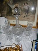 A mid 20th century cut glass decanter and 6 glasses.