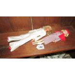 A Lady Penelope doll and a Bionic woman doll with small holdall of accessories.