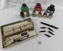 A quantity of old ink bottles, calligraphy set etc.