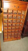 A stained pine wine rack. ****Condition report**** Height 123cm. Depth 32cm.