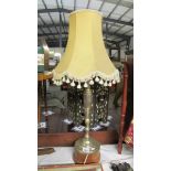 A tall 1920/30's silver plated on brass table lamp.