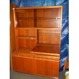 A teak drinks/display cabinet.