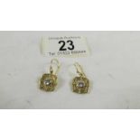 A pair of 9ct gold earrings, 3 grams.