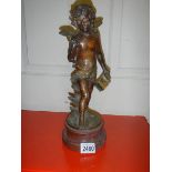 A spelter figure of Cupid. 37 cm tall.