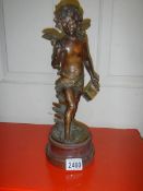 A spelter figure of Cupid. 37 cm tall.