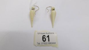 A pair of antique earrings in yellow metal. ****Condition report**** Length 55mm.