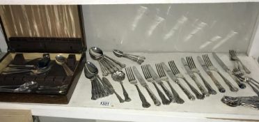 A quantity of silver plate cutlery (2 designs).