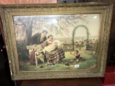 A large Edwardian gilt framed watercolour family scene in the garden signed L M Roth.