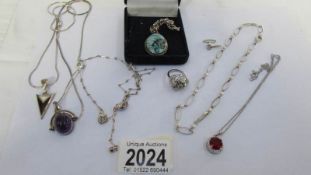 7 items of silver jewellery including pendants.