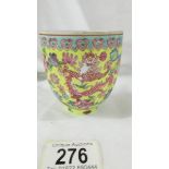 A Chinese eggshell porcelain yellow ground famille rose bowl (wine cup?),
