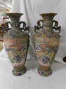 A pair of tall Satsuma vases, 46 cm tall.