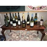 12 bottles of various alcohol including Hiedsieck & Co., champagne.