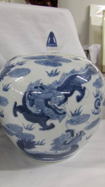 A striking pair of large blue and white lidded porcelain melon ginger jars with dragons chasing - Image 6 of 6