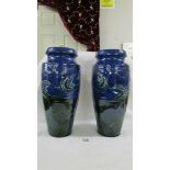 A pair of C H Branham Barum, Barnstaple 31 cm blue vases,
