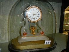 A good French alabaster mantle clock under dome with swinging cherub pendulum.