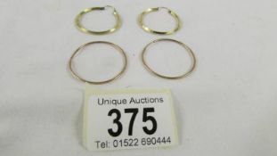 2 pairs of gold hoop earrings, 5 grams.