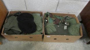 2 boxes of military and camouflage clothing.